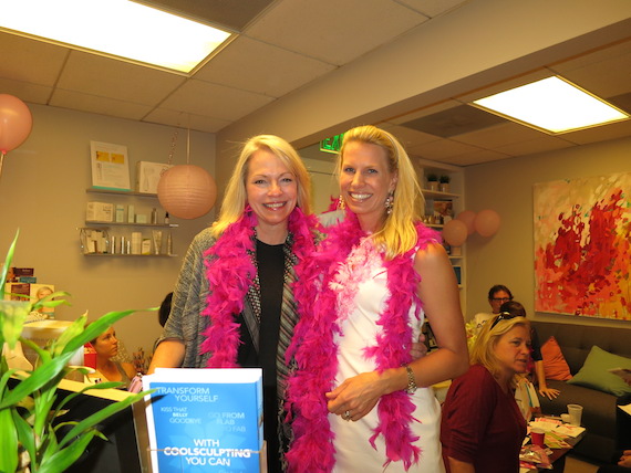 Wearing hot pink feather boas makes any Wednesday a fun BRA Day!